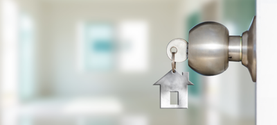 Future of real estate showing key in a door knob