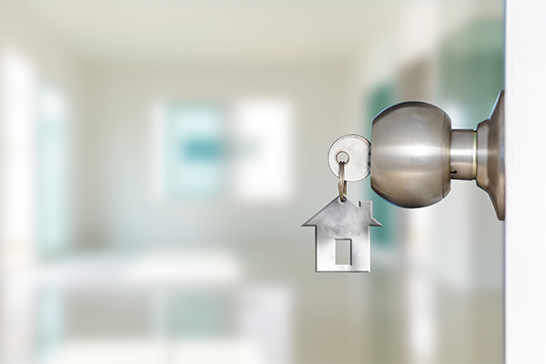 Future of real estate showing key in a door knob