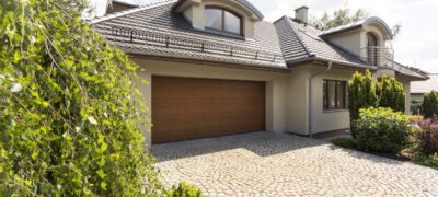 Exterior of a single family home With Cobblestone Driveway