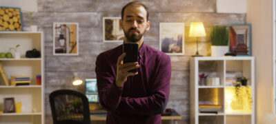 man in office choosing smart home devices on phone