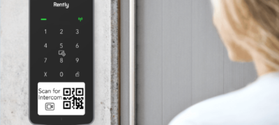 woman uses an access panel with intercom smart access control system